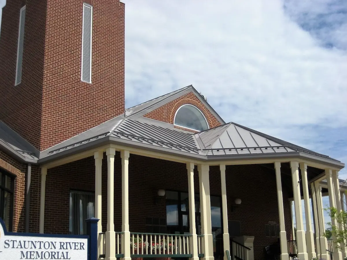 Skilled roofing craftsmen working on a residential roof in Regency
